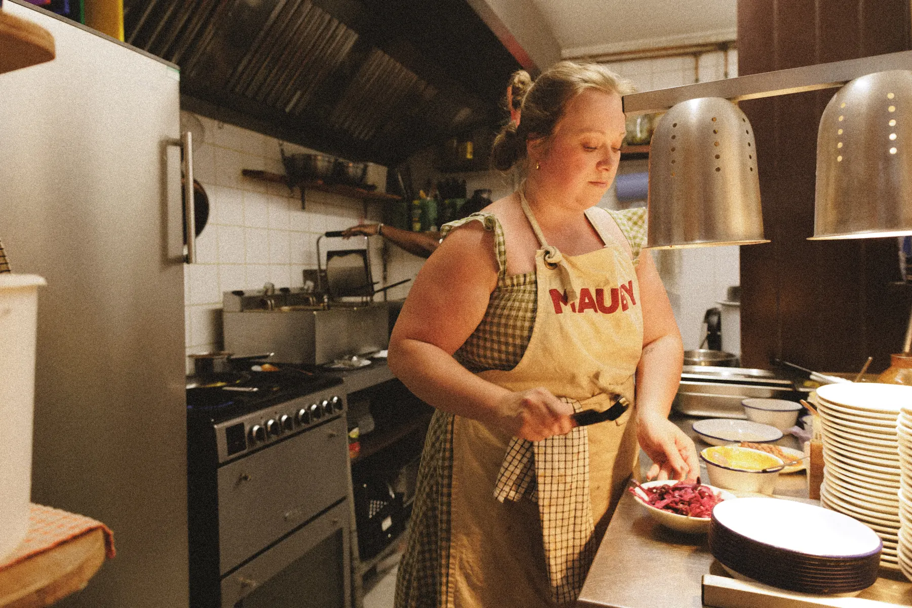 Heleena preparing food in the Mauby kitchen